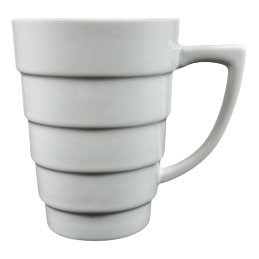 Krups white ceramic Frank Lloyd Wright vintage Guggenheim mug with stepped spiral bands and angular handle