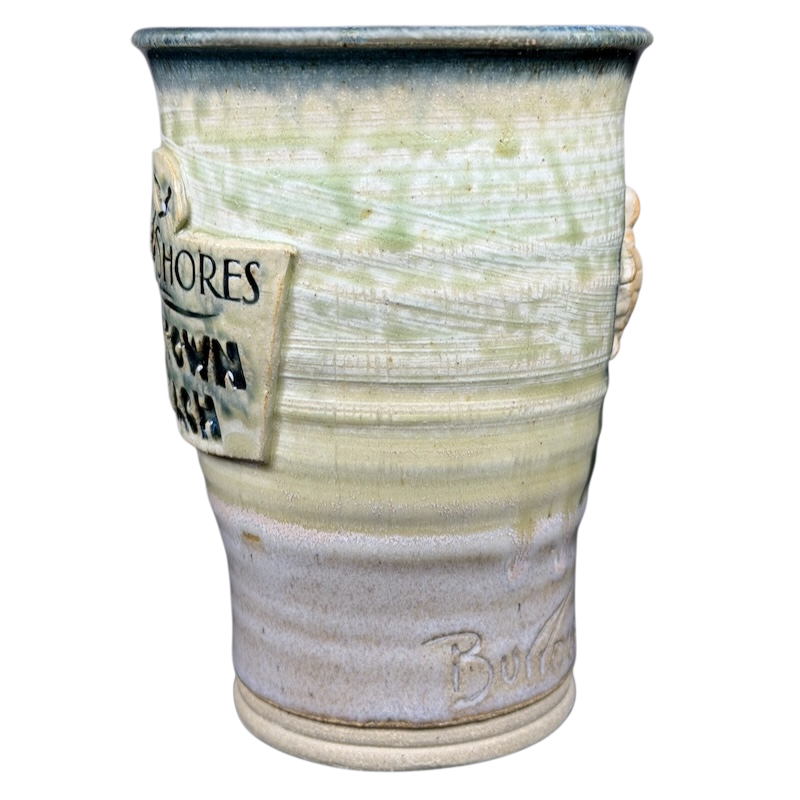 Unique Gulf Shores sea turtle pottery mug featuring intricate design and natural colors