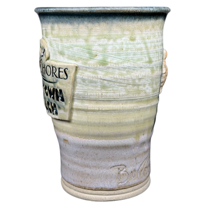 Unique Gulf Shores sea turtle pottery mug featuring intricate design and natural colors