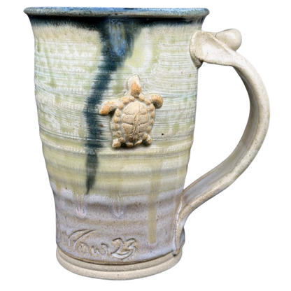 Gulf Shores sea turtle pottery mug with textured design and turtle accent for unique coastal charm