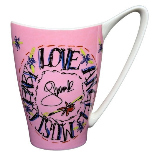 Gwen Stefani collectible mug featuring a pink design with colorful lettering and dragonflies
