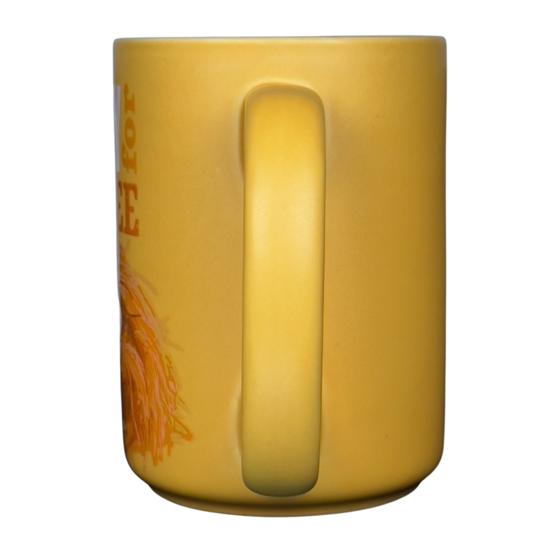 Hallmark Walt Disney yellow mug showing handle and partial Animal Muppets vintage coffee mug illustration