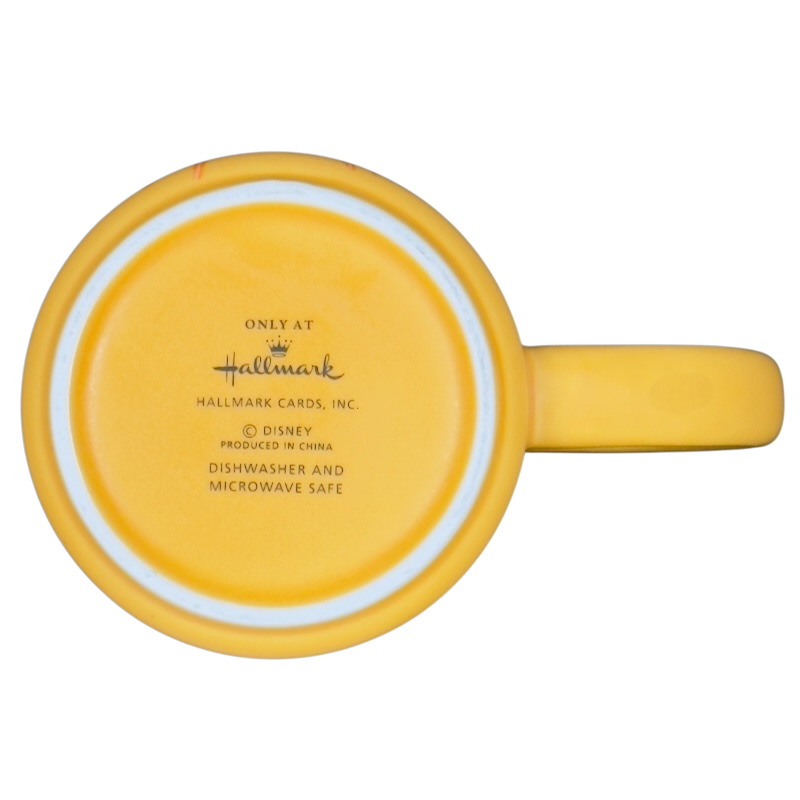 Yellow Hallmark Disney mug bottom showing Hallmark logo and dishwasher microwave safe text on Animal Muppets vintage coffee mug