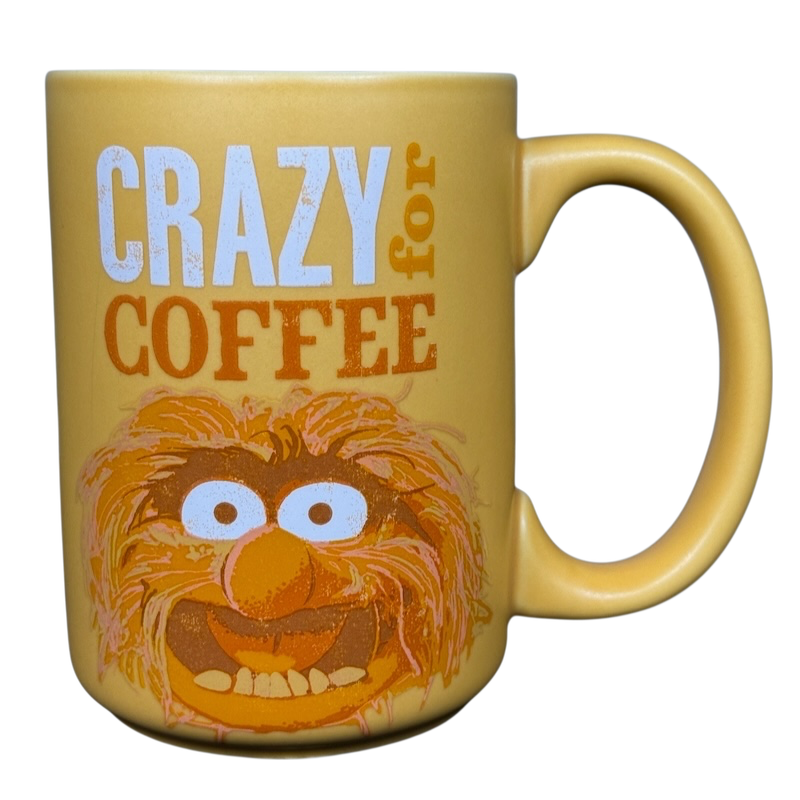 Yellow Hallmark Walt Disney Animal Muppets vintage coffee mug with Crazy for Coffee text and Animal face illustration