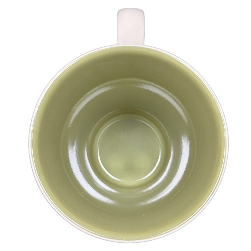 Top view of Hallmark collectible Snow White Disney mug with light green interior and white handle