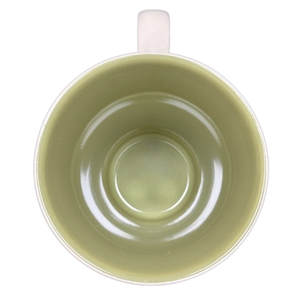 Top view of Hallmark collectible Snow White Disney mug with light green interior and white handle