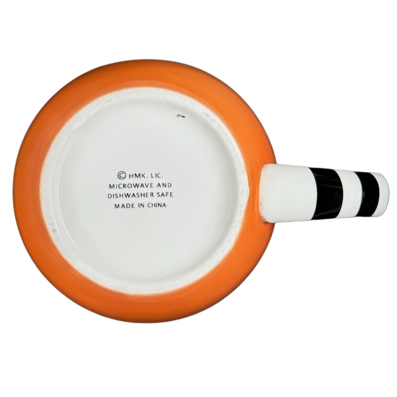 Bottom view of Hallmark Halloween Jack-O'-Lantern vintage mug showing care instructions and design details