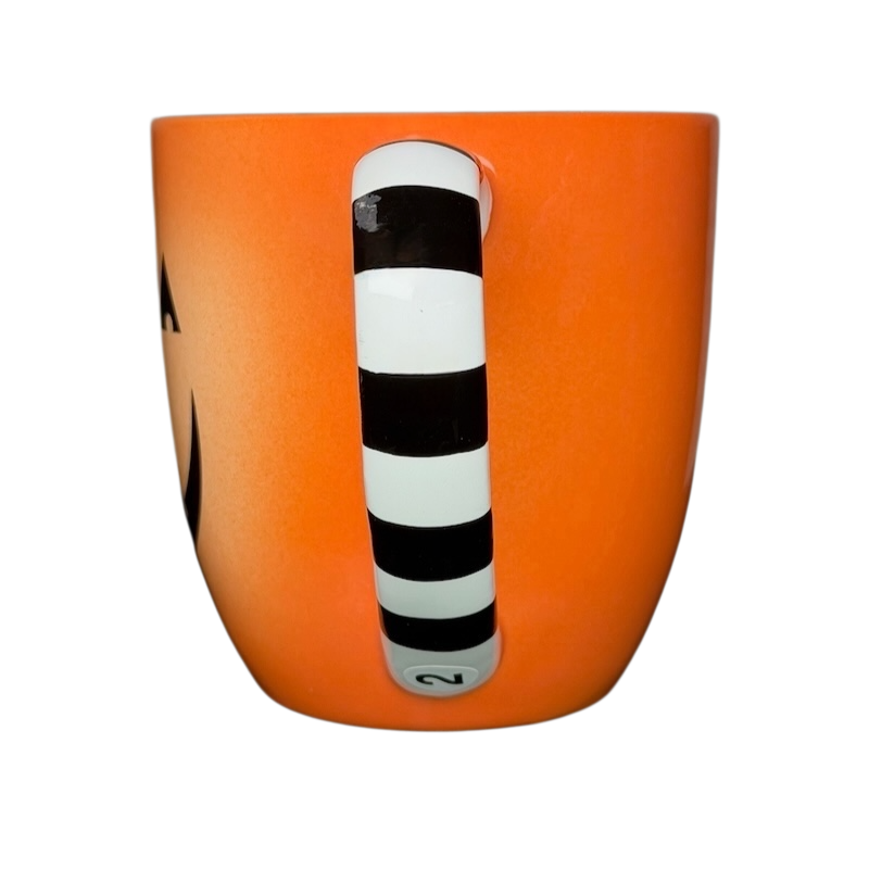 Hallmark Halloween Jack-O'-Lantern vintage mug in orange with a striped handle for festive drinks