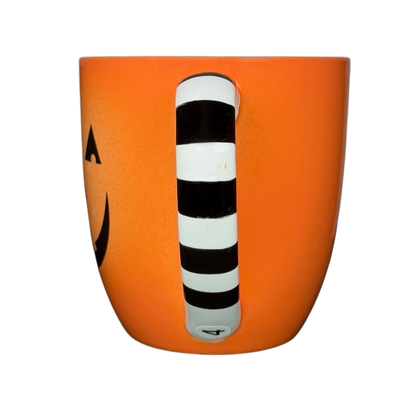 Hallmark Halloween Jack-O'-Lantern vintage mug with a black and white striped handle