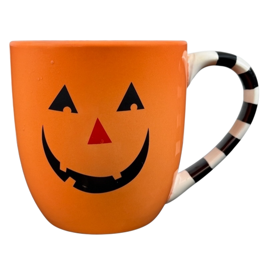 Hallmark Halloween Jack-O'-Lantern vintage mug in orange with a smiling face and striped handle