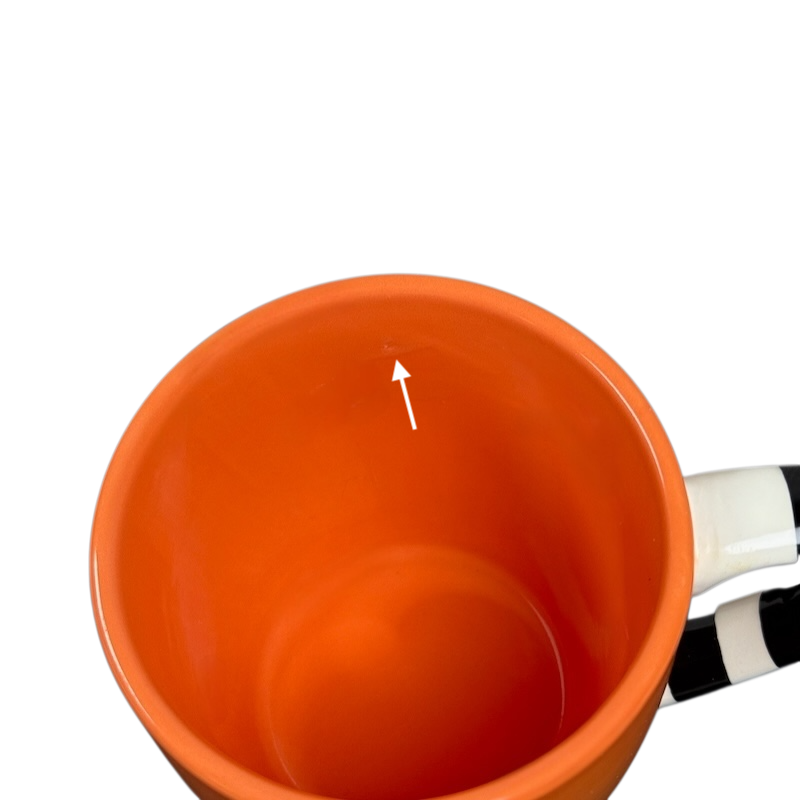 Interior view of Hallmark Halloween Jack-O'-Lantern vintage mug in bright orange color