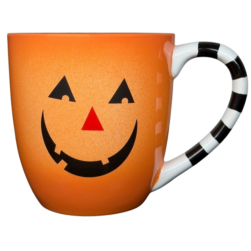 Hallmark Halloween Jack-O'-Lantern vintage mug with cheerful pumpkin design and striped handle
