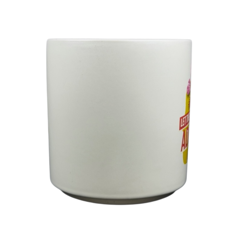 Hallmark mug featuring Peanuts movie Snoopy and Fifi adventure design with vibrant colors