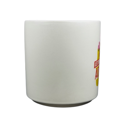 Hallmark mug featuring Peanuts movie Snoopy and Fifi adventure design with vibrant colors