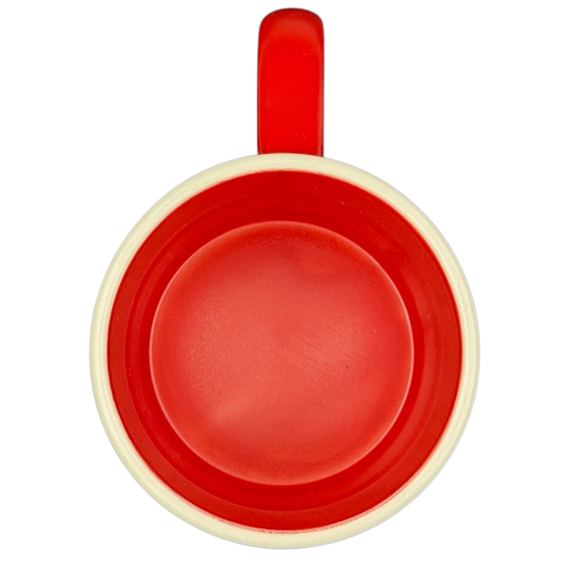 Top view of a red Hallmark mug featuring Peanuts movie Snoopy and Fifi adventure design