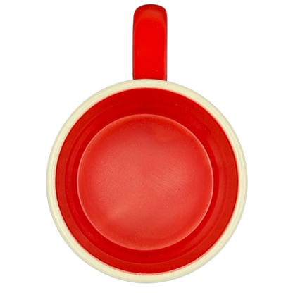 Top view of a red Hallmark mug featuring Peanuts movie Snoopy and Fifi adventure design