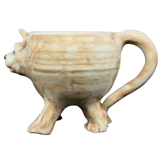 Handcrafted dog figural pottery mug with a unique cat shape and detailed texture