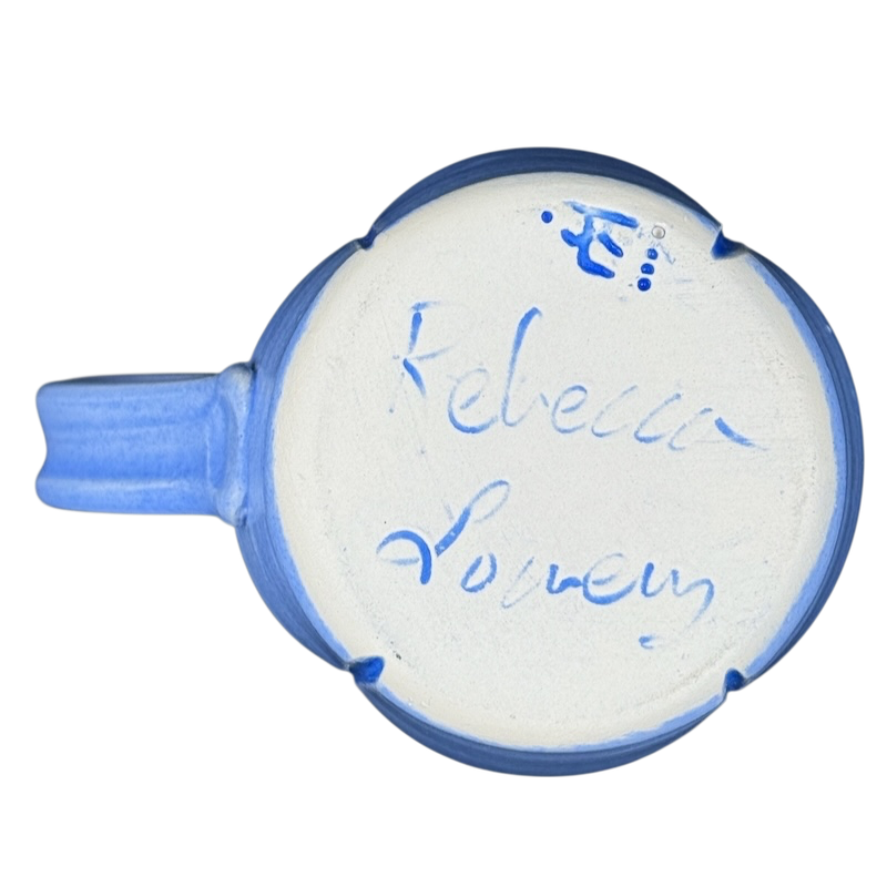 Bottom view of Rebecca Lowery vintage blue pottery mug showing handwritten signature and blue handle