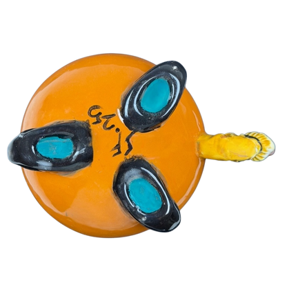 Unique handmade witch cauldron mug in orange with black and turquoise accents