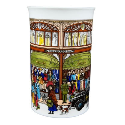 Harrods Knightsbridge London Storefront Scene Mug featuring colorful crowd and store details