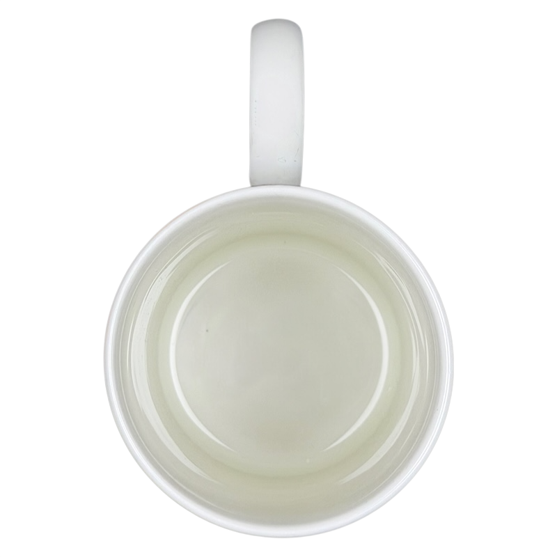 Top view of the Harrods Knightsbridge Teddy Bear Green Sweater Mug with a smooth white interior