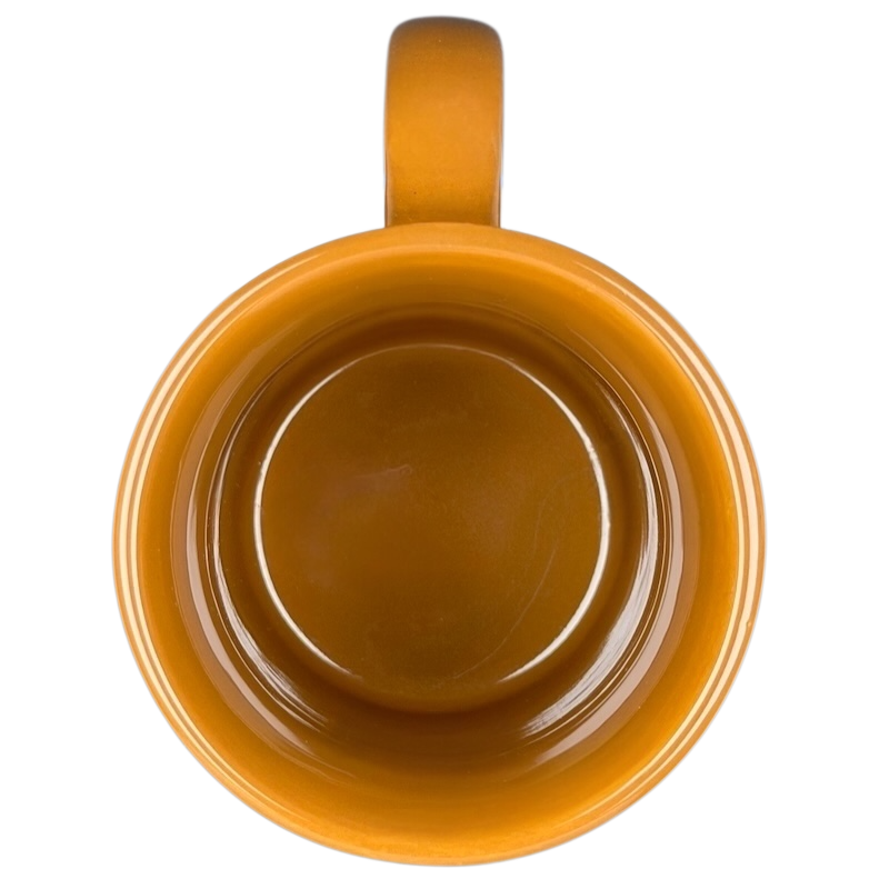 A top view of a yellow Hawaiian Islands Mug Island Heritage with a smooth interior