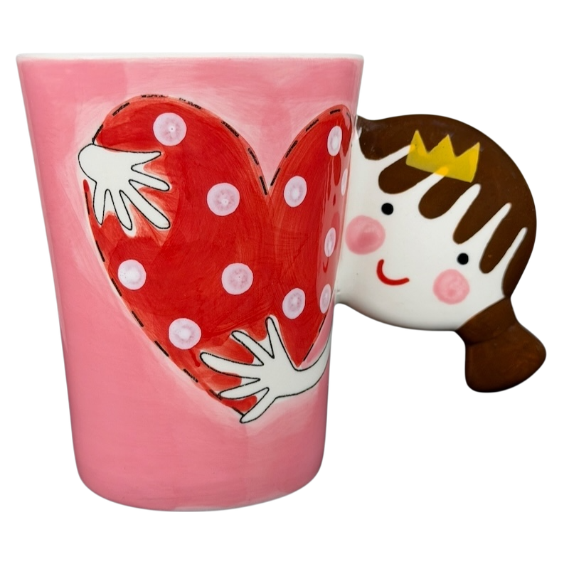 Heart Hug Girl Mug Indra featuring a playful design with a red heart and a smiling girl
