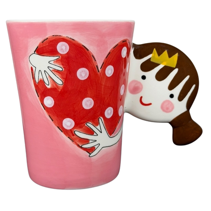 Heart Hug Girl Mug Indra featuring a playful design with a red heart and a smiling girl