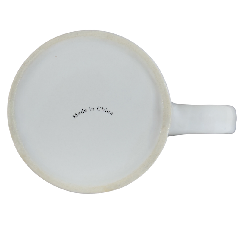 Bottom view of a helium anniversary mug collectible showcasing its craftsmanship and origin details