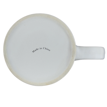 Bottom view of a helium anniversary mug collectible showcasing its craftsmanship and origin details