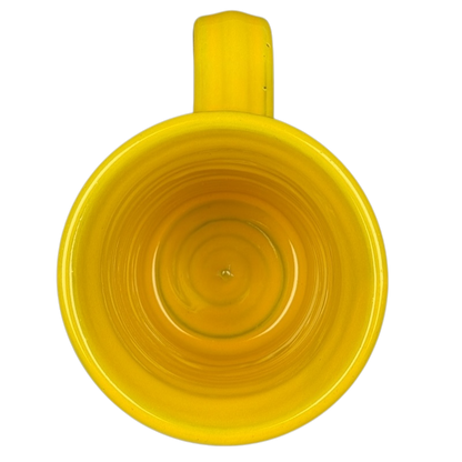 Top view of Hell's Backbone Deneen Pottery yellow mug 2014 showcasing its smooth inner surface