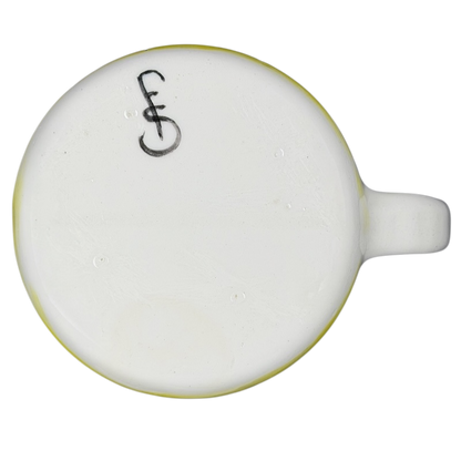 Bottom of a hidden frog vintage pottery mug showcasing its unique design and artisan craftsmanship