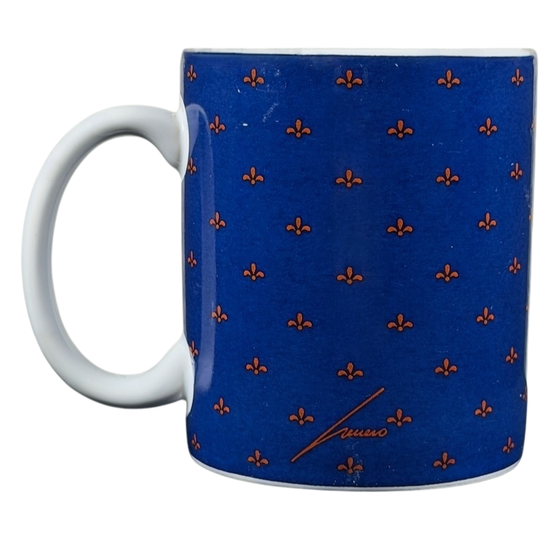 Hugo Hege cat Lang & Wise mug featuring a blue design with a fleur-de-lis pattern and a classic shape