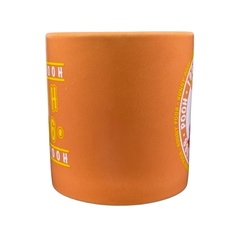 Hunny Pooh 1966 collectible Disney mug in orange with classic character design