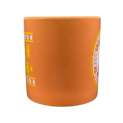 Hunny Pooh 1966 collectible Disney mug in orange with classic character design