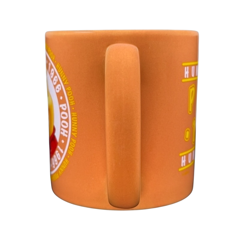 Hunny Pooh 1966 collectible Disney mug featuring a vibrant design and sturdy handle