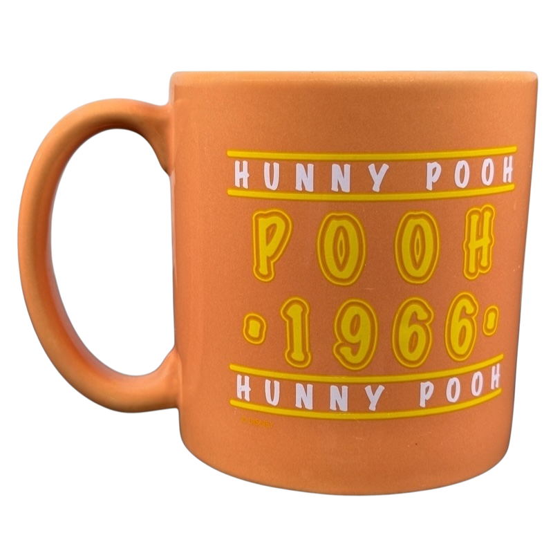Hunny Pooh 1966 collectible Disney mug in orange with playful text design