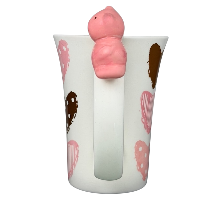 Indra Heart Polka Dot Piggy handle mug featuring a playful pig design on a heart-patterned cup