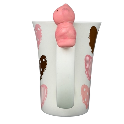 Indra Heart Polka Dot Piggy handle mug featuring a playful pig design on a heart-patterned cup