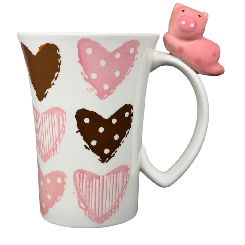 Indra Heart Polka Dot Piggy handle mug featuring colorful hearts and a cute piggy handle