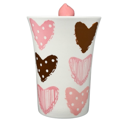 Indra Heart Polka Dot Piggy handle mug with colorful heart patterns in pink and brown