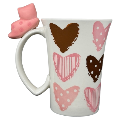 Indra Heart Polka Dot Piggy handle mug featuring colorful hearts and a unique piggy handle design