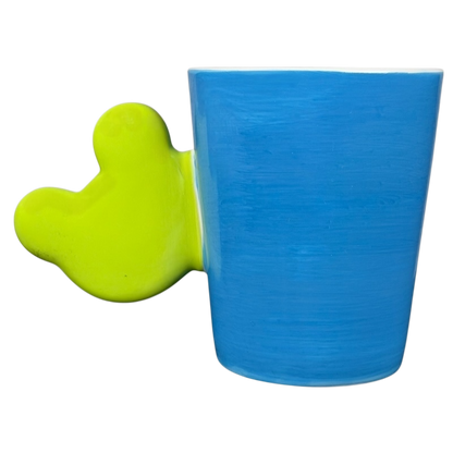 Spotted Green Frog Mug Indra with a playful green handle and blue ceramic body