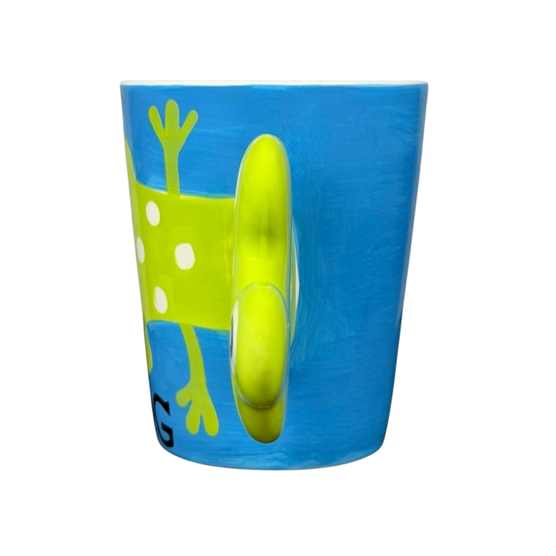 Spotted Green Frog Mug Indra with playful frog design and vibrant blue background