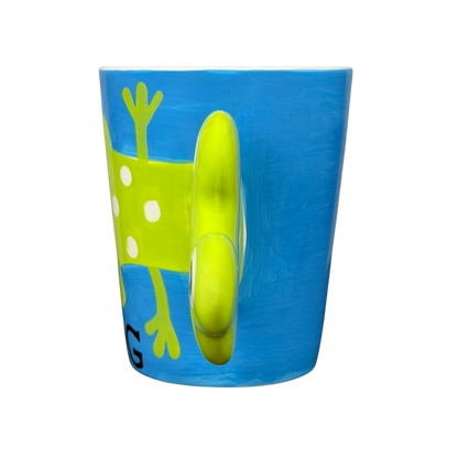 Spotted Green Frog Mug Indra with playful frog design and vibrant blue background