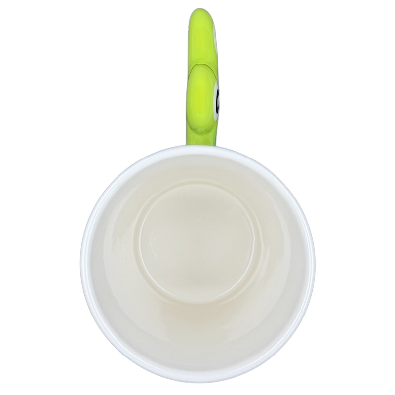 Top view of Spotted Green Frog Mug Indra showcasing a simple design with a vibrant green handle