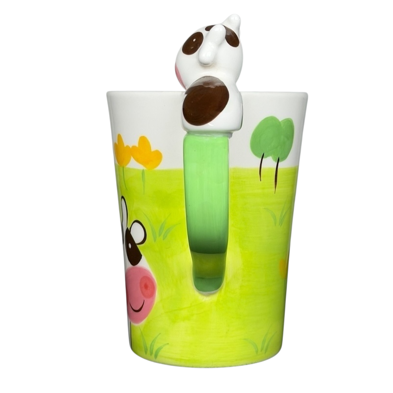 Indra vintage cow handle mug featuring a playful cow design and colorful landscape
