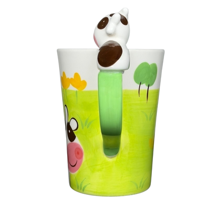 Indra vintage cow handle mug featuring a playful cow design and colorful landscape
