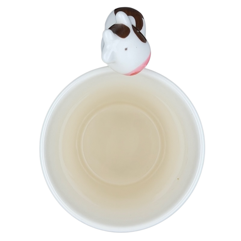 Indra vintage cow handle mug featuring a whimsical cow design on top for a playful touch
