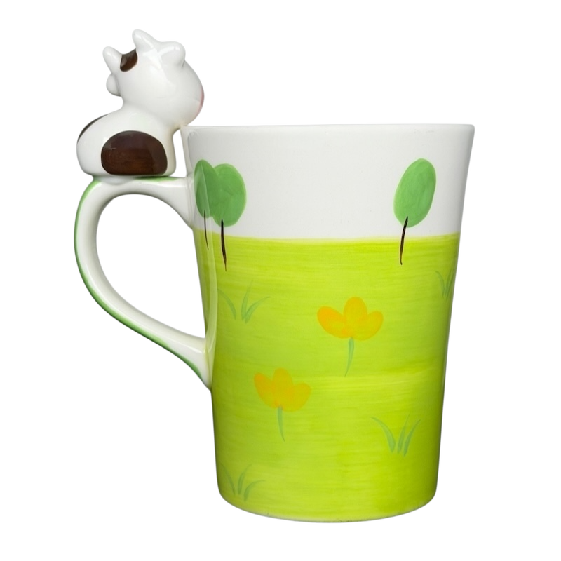 Indra vintage cow handle mug with colorful flower design and playful cow accent